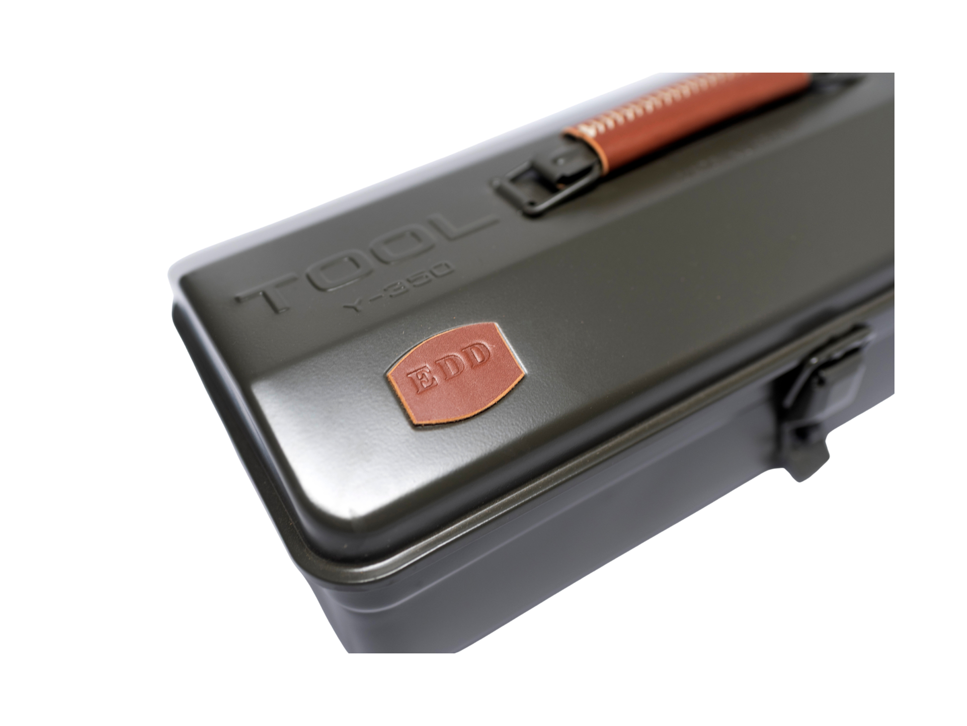A dark gray metal toolbox with a copper-colored handle and a matching shield-shaped ZDD logo badge on the lid, shown against a plain white background.