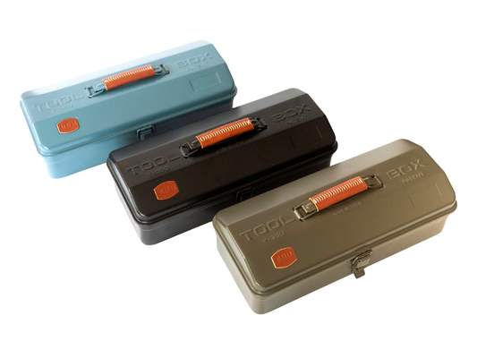 Three rectangular TOOL BOX 301A tool cases shown on a white background, arranged diagonally. The cases are in light blue, dark gray, and olive green, each with an orange handle and a small orange logo badge.