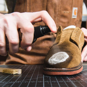Otter Wax suede cleaner being sprayed onto suede shoe